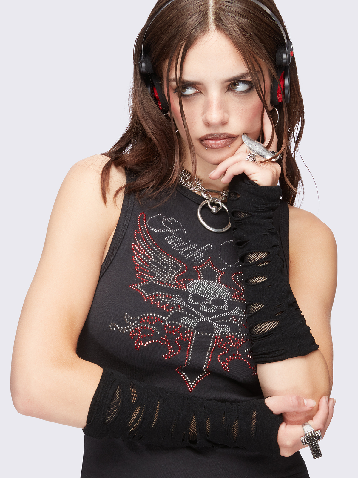 Black cut-out arm warmers featuring a fishnet layer underneath. 