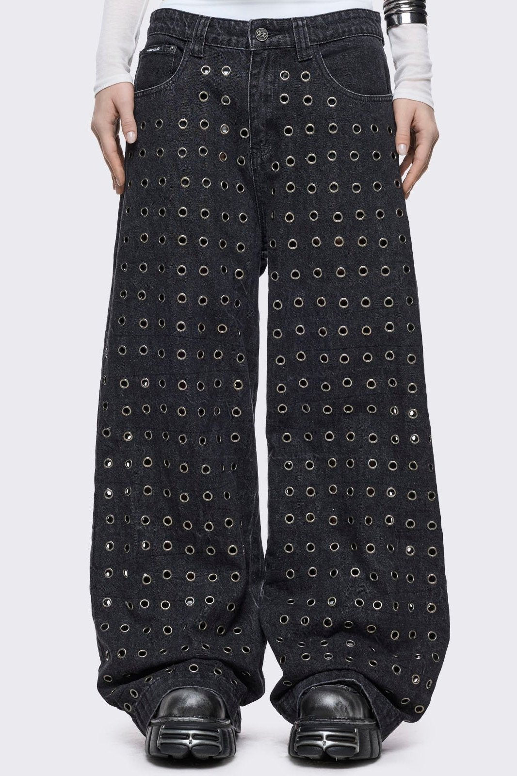 Black washed baggy jeans with all over silver eyelets. 