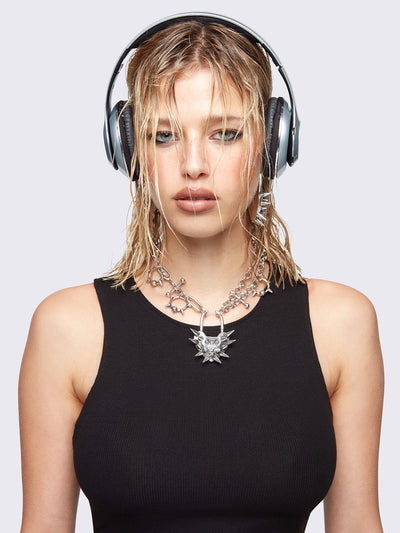 Chunky charm necklace with Spiked heart lock pendant and bold metal piercings details. 