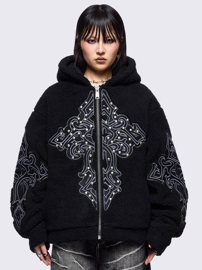 Black fleece hoodie jacket featuring a cross patch on front and sleeves and silver stud details.