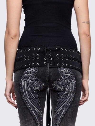Black faux leather wide belt with silver eyelet, lace-up details and long tassel fringe