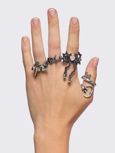 Set of 4 silver rings: Bunny, "angel", heart bow and key designs.