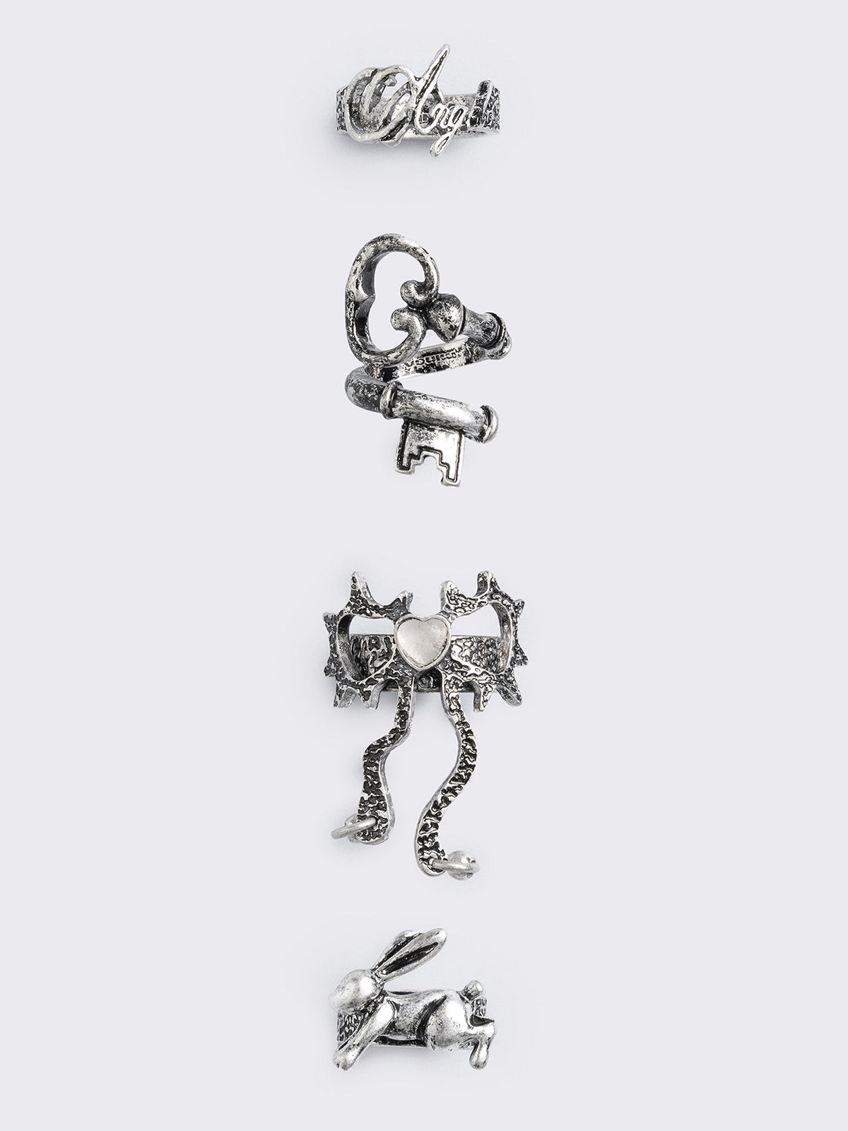 Set of 4 silver rings: Bunny, "angel", heart bow and key designs.