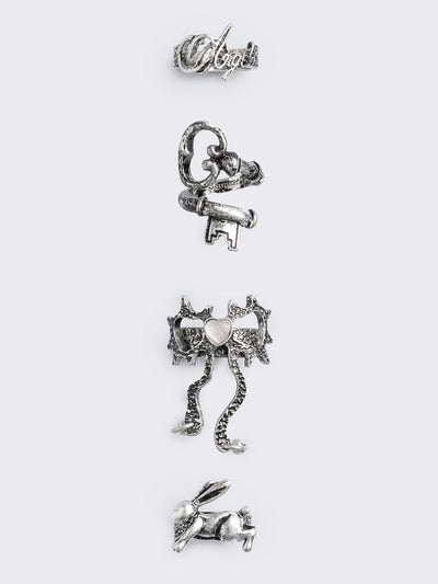 Set of 4 silver rings: Bunny, "angel", heart bow and key designs.