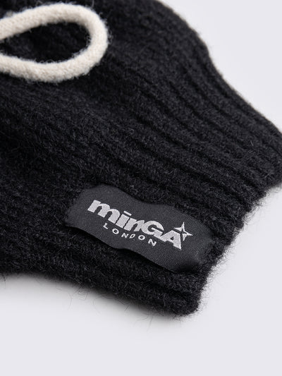 Black knitted leg warmers with white tie bows and a flared style.