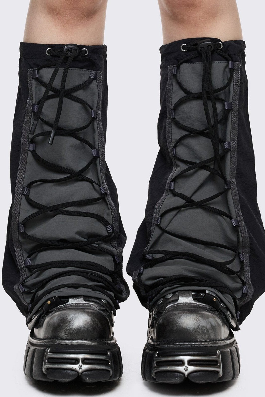 Black tech flared leg warmers with grey panel with lace-up and adjustable toggle