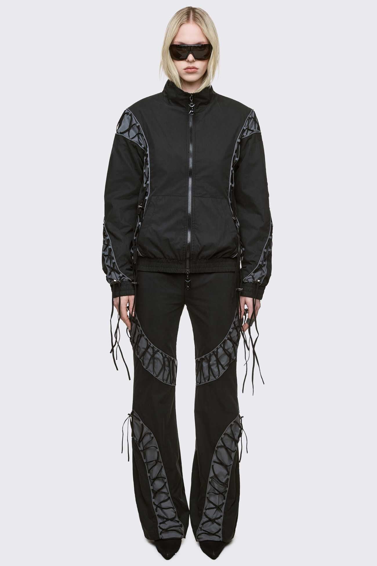 Black parachute baggy flared pants with grey panels with lace up. 
