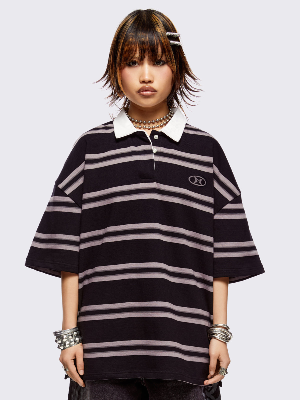 Black and grey striped rugby polo with white spread collar and a oversized fit.