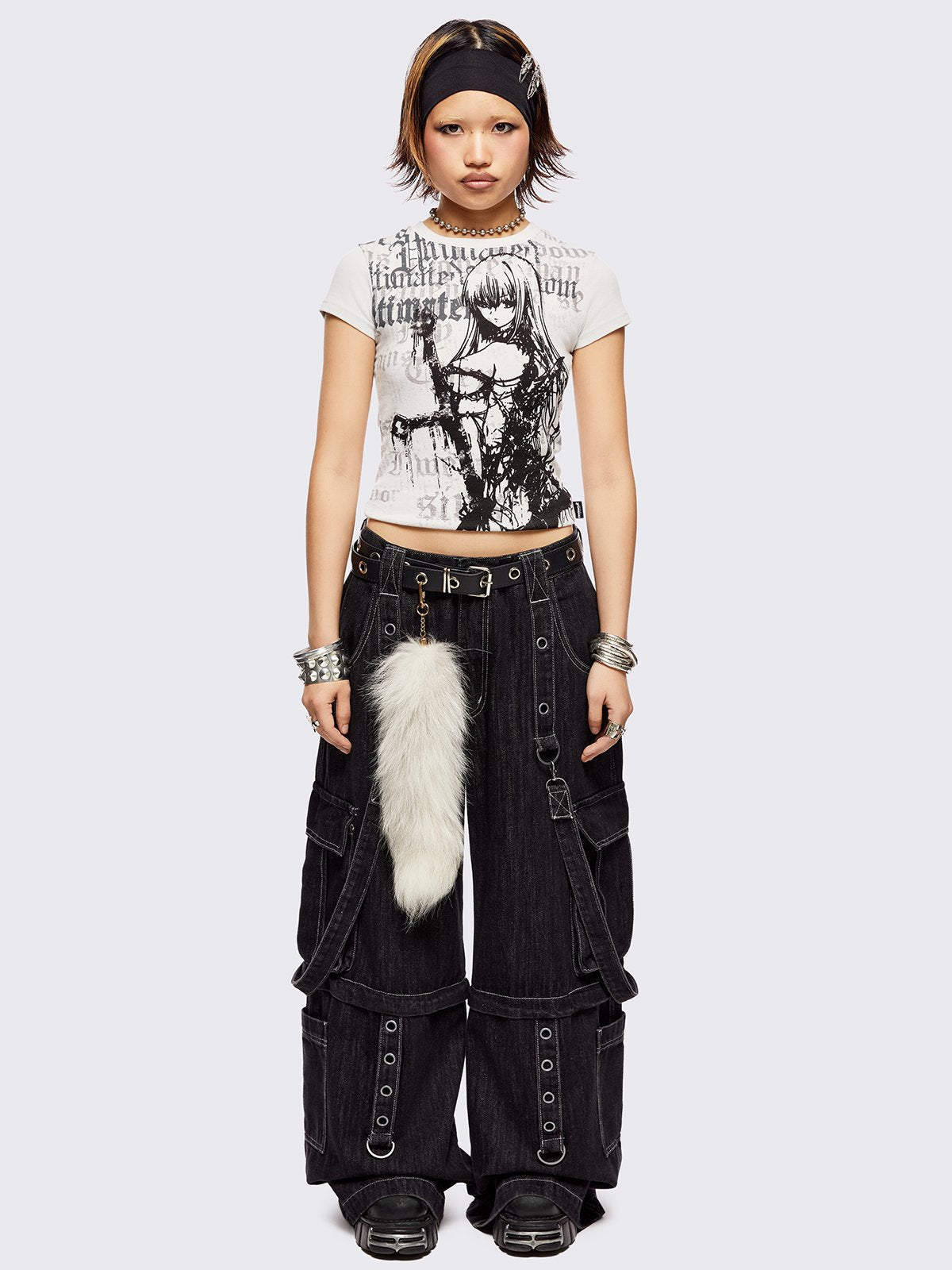 Black multi pocket cargo jeans featuring a detachable-leg with zipper and all over straps and D-rings details.