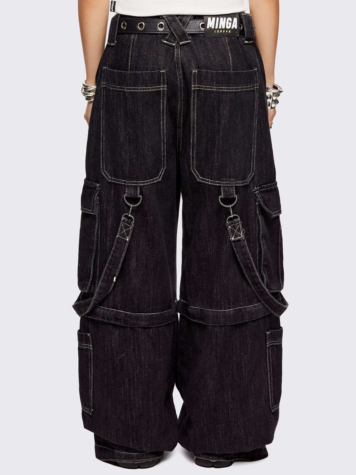 Black multi pocket cargo jeans featuring a detachable-leg with zipper and all over straps and D-rings details.