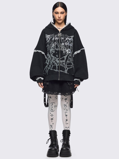 White opaque tights with kaomoji ASCII-style print.