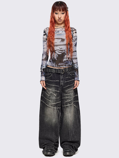 Black and grey graphic mesh crop top with cut-out and safety pins.