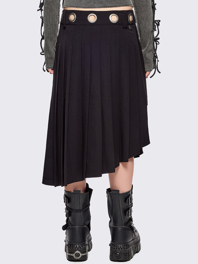Black pleated asymmetric midi skirt with silver eyelet on waistband