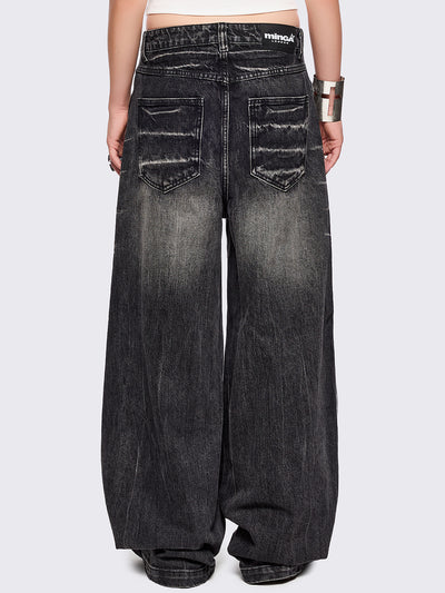 Black washed baggy jeans with grey overdye and distressed wrinkle-effect.