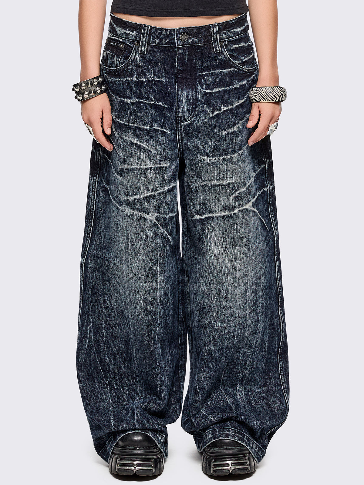 Blue washed wide leg baggy jeans featuring a grey overdye and distressed wrinkle-effect.