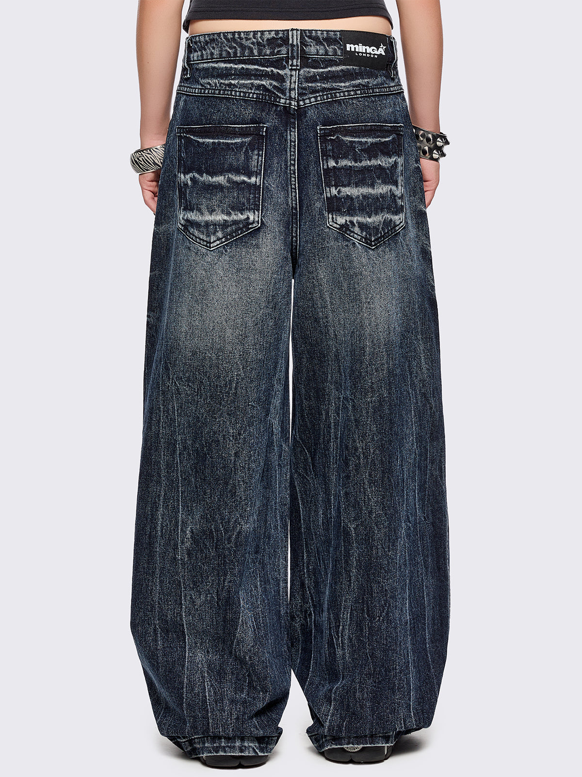 Blue washed wide leg baggy jeans featuring a grey overdye and distressed wrinkle-effect.