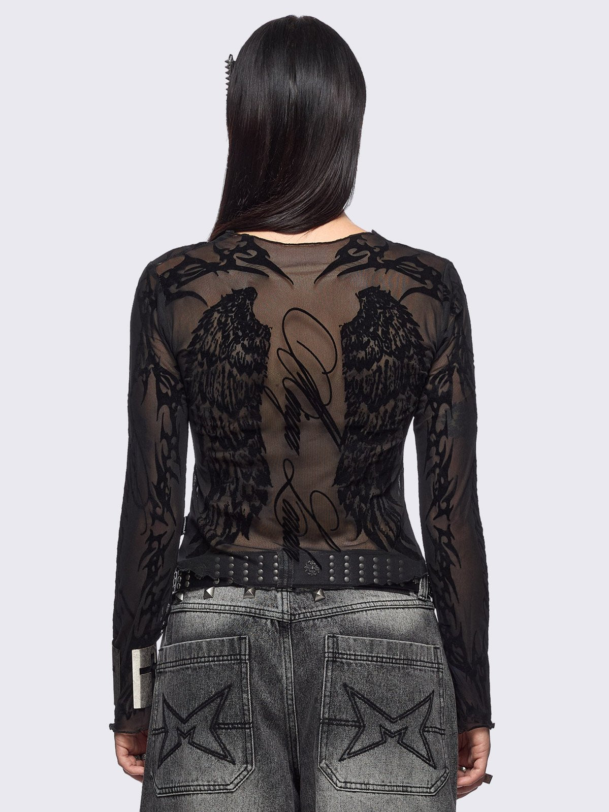 Black mesh top with winged corset and sigilism graphic print.