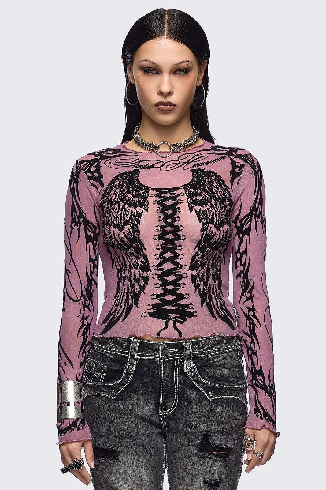 Pink mesh top with black winged corset and sigilism graphic print.
