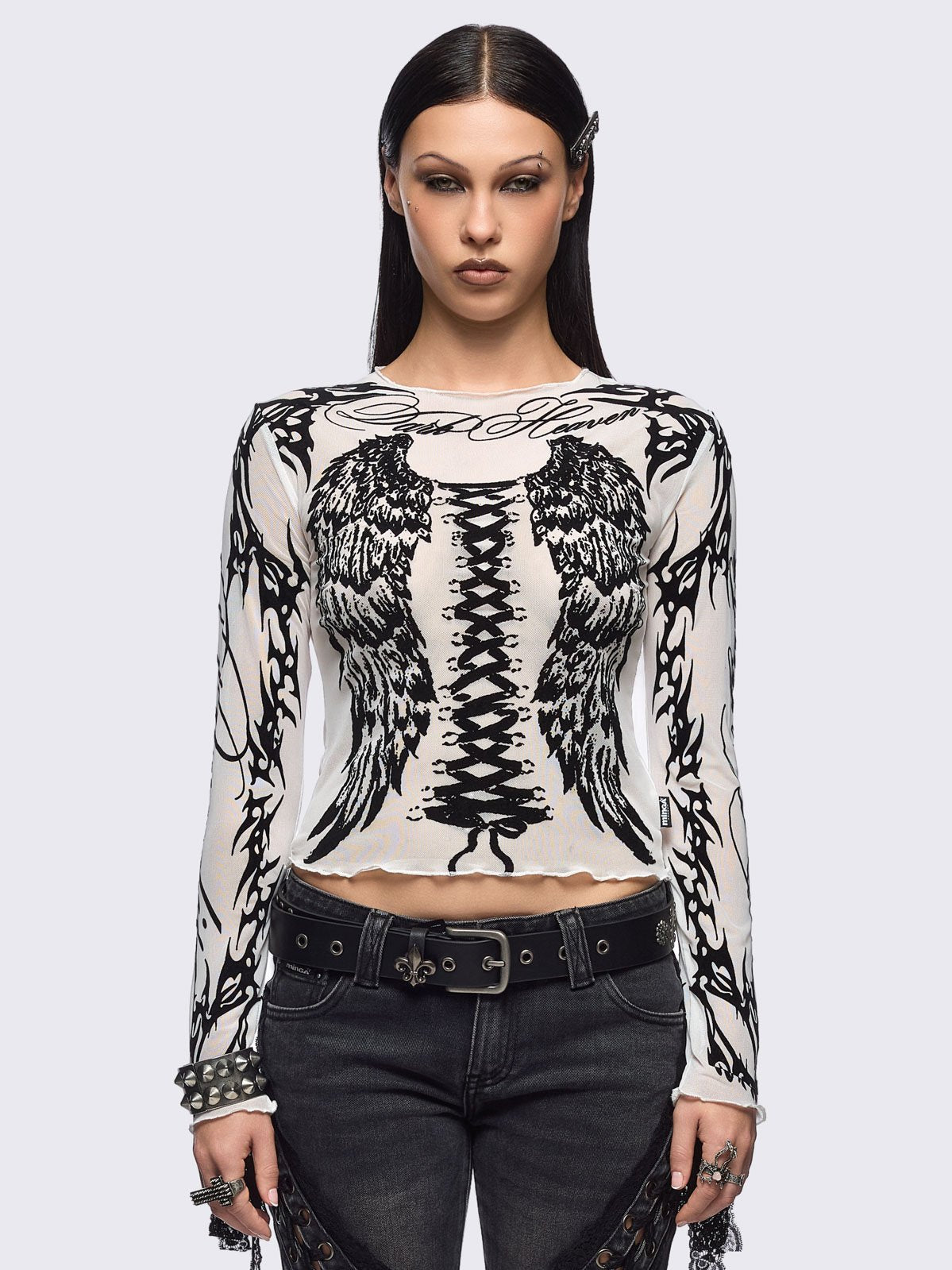 White mesh top with black winged corset and sigilism graphic print.