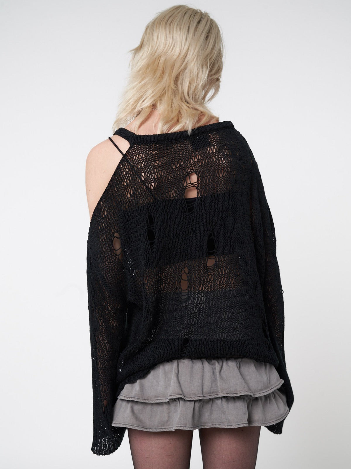 Net knitted jumper in black featuring all over distressed details