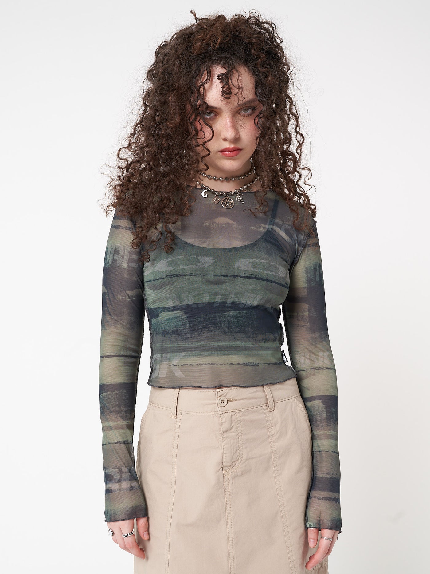 Printed mesh top in green featuring all over grunge graphic print 