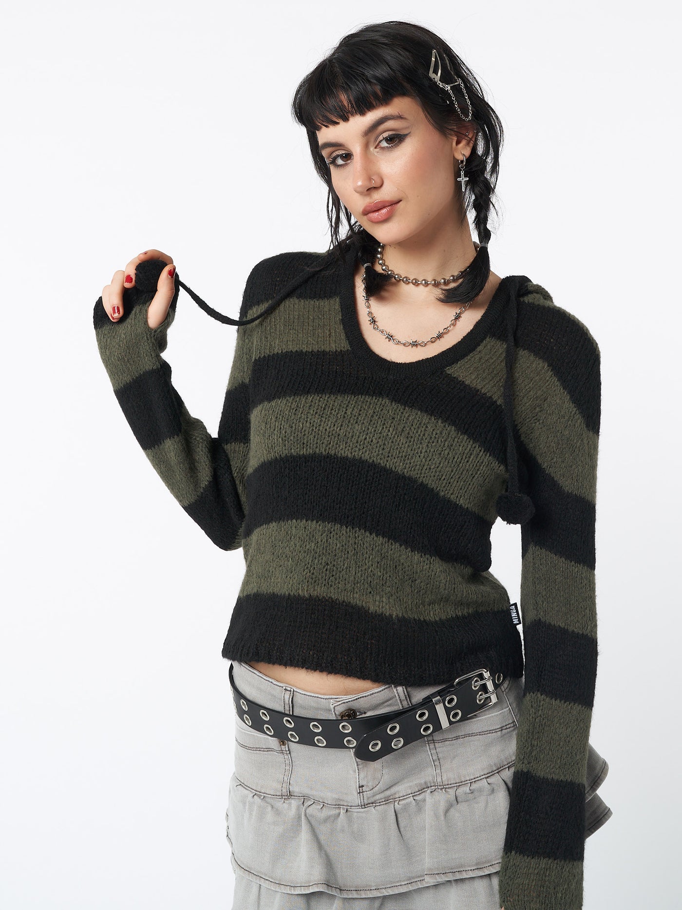 Hooded knit jumper with stripes in black and green featuring pom pom drawstring and thumbhole cuffs