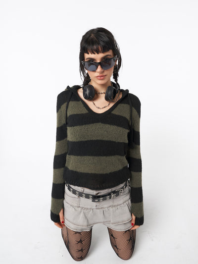 Hooded knit jumper with stripes in black and green featuring pom pom drawstring and thumbhole cuffs