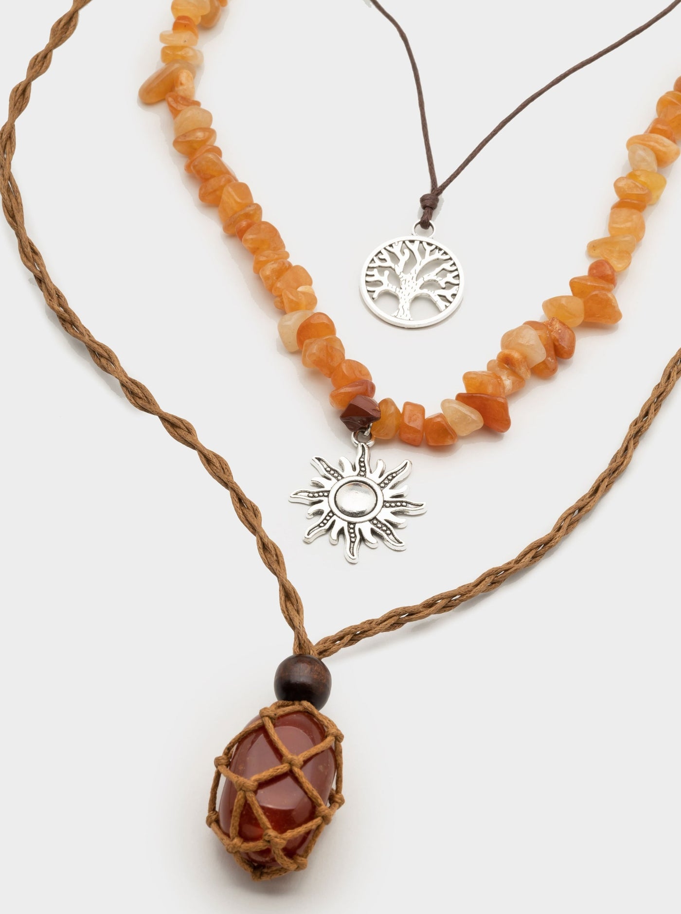 Set of 3 necklaces with sun, tree of life and caged brown stone pendants