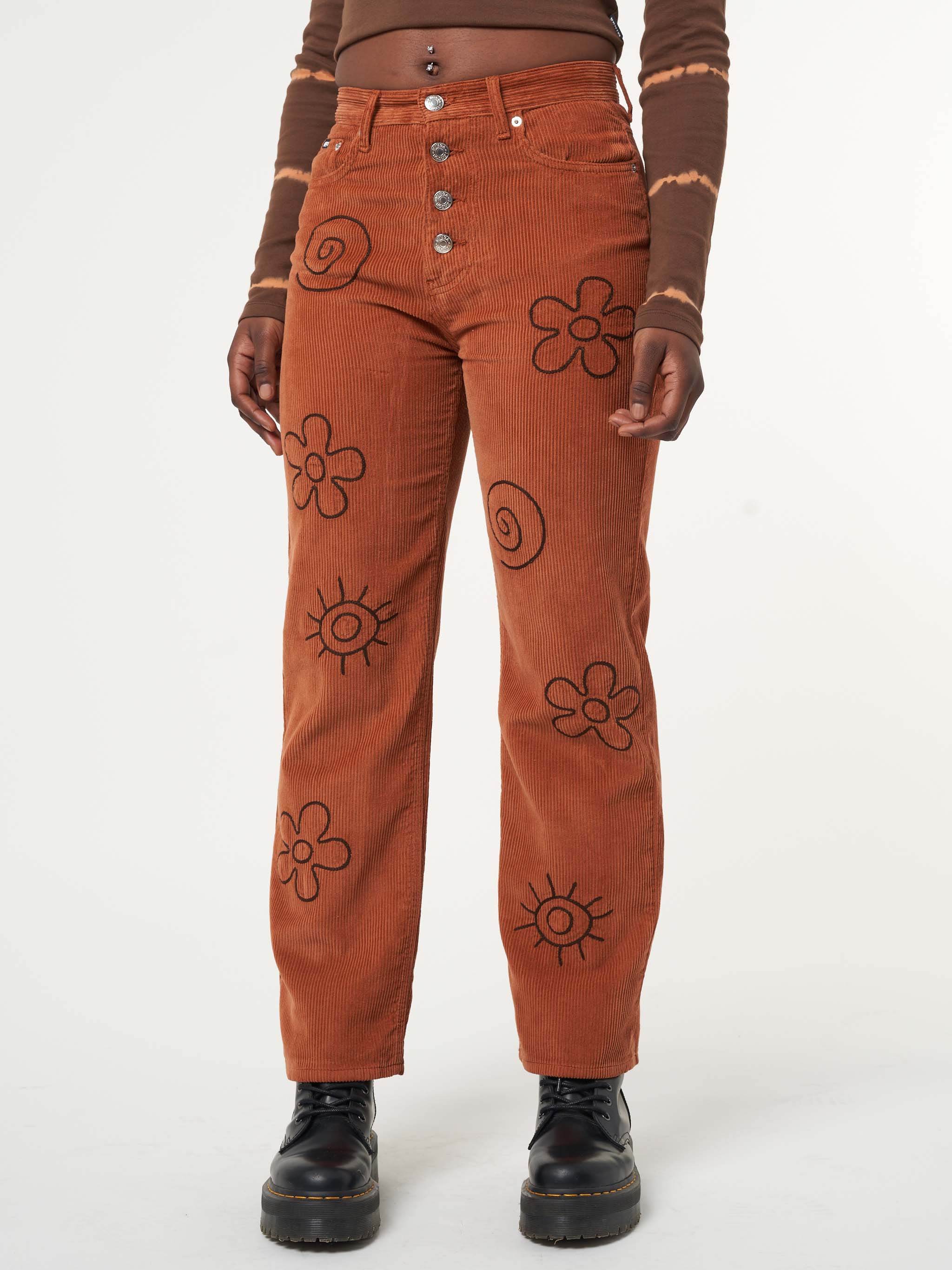 Corduroy pants in rust with front flowers, sun and spirals embroideries 