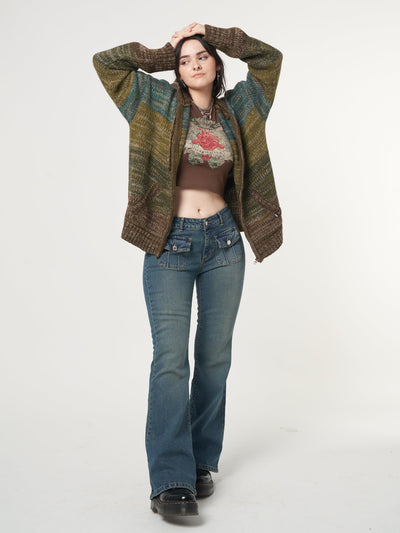Low rise flare jeans with mini front pockets and vintage green overdye wash