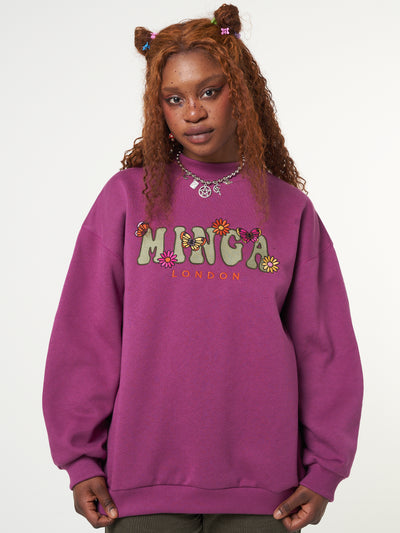 Oversized fit sweater in purple orchid with Minga London flowers and butterflies front embroidery