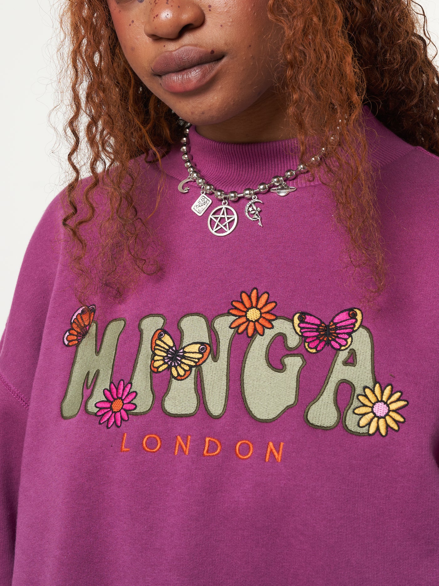 Oversized fit sweater in purple orchid with Minga London flowers and butterflies front embroidery