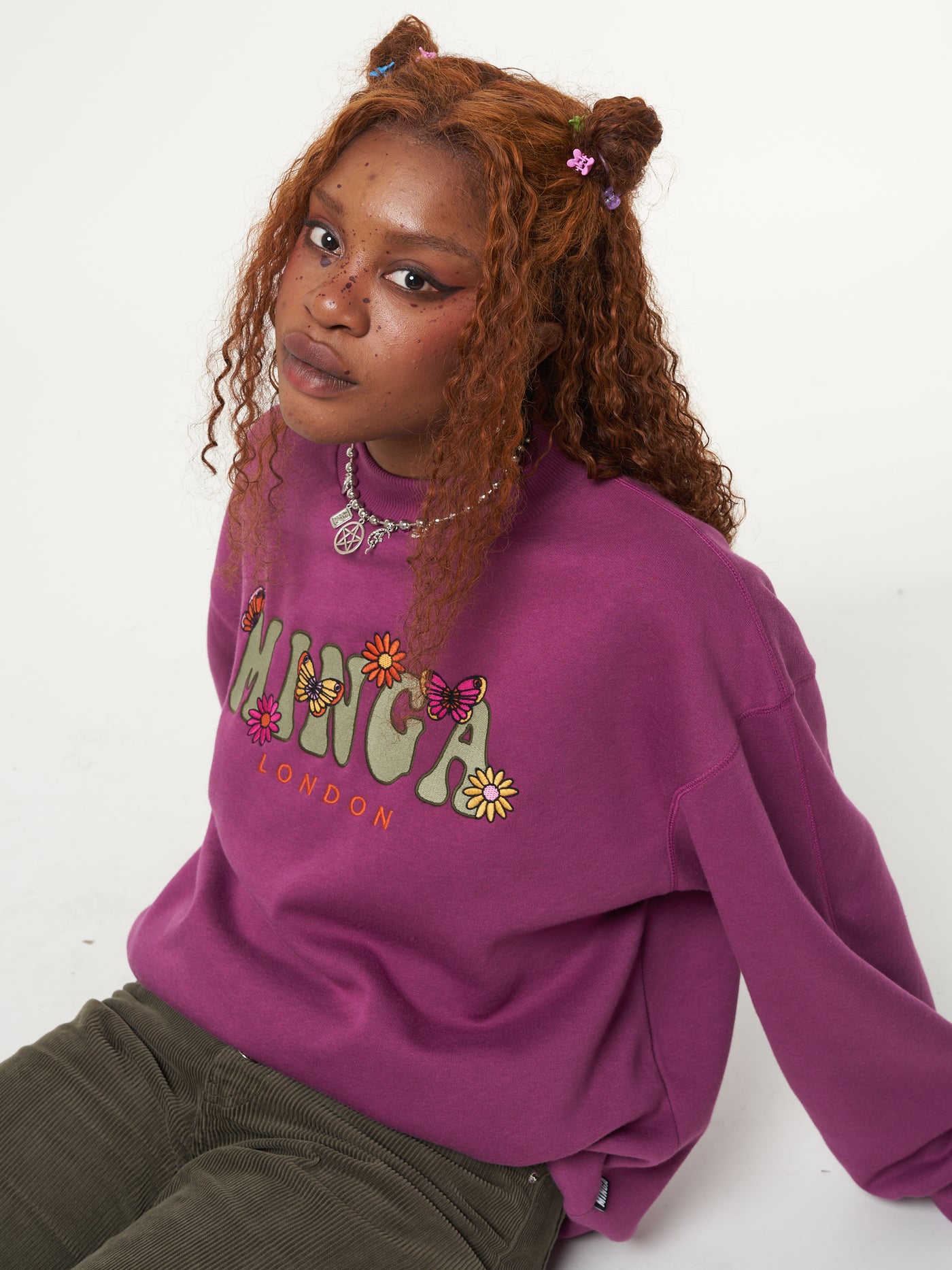 Oversized fit sweater in purple orchid with Minga London flowers and butterflies front embroidery