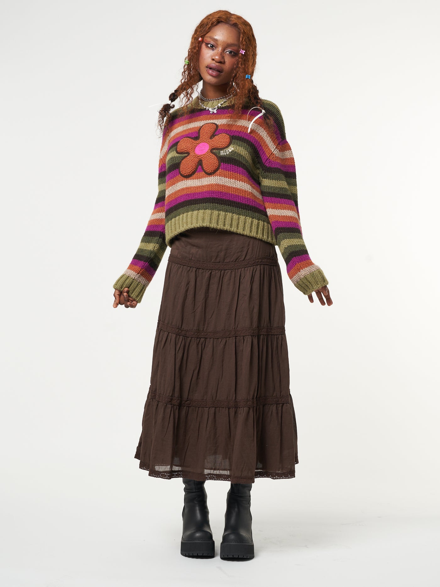 Knitted jumper in orange, pink, green and brown stripes featuring front Retro Flower embroidery