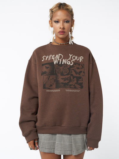 Sweatshirt in brown with Spread Your Wings front graphic print