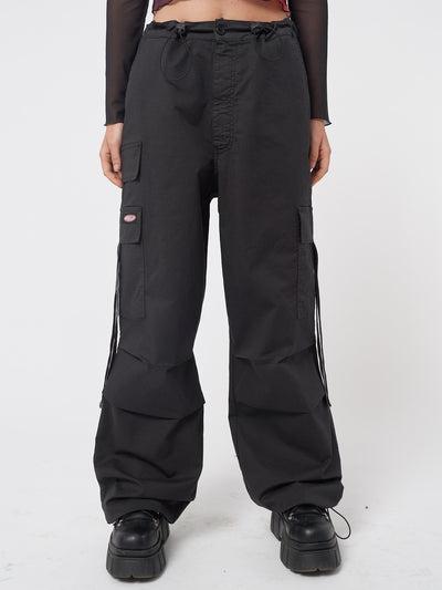 Black tech cargo pants in parachute style with side utility pockets 