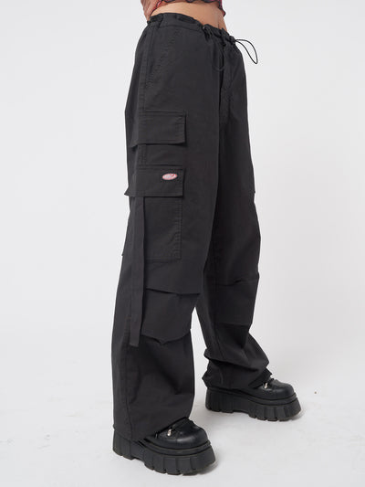 Black tech cargo pants in parachute style with side utility pockets 