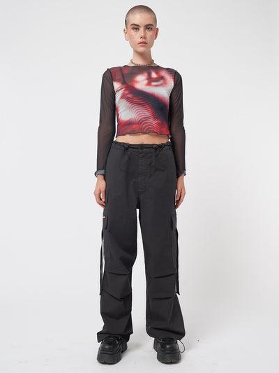 Black tech cargo pants in parachute style with side utility pockets 