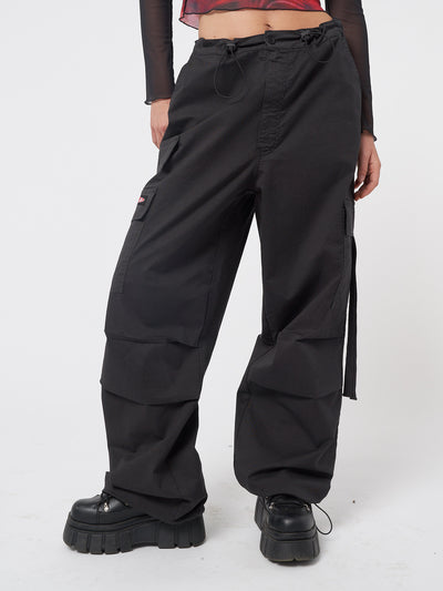 Black tech cargo pants in parachute style with side utility pockets 